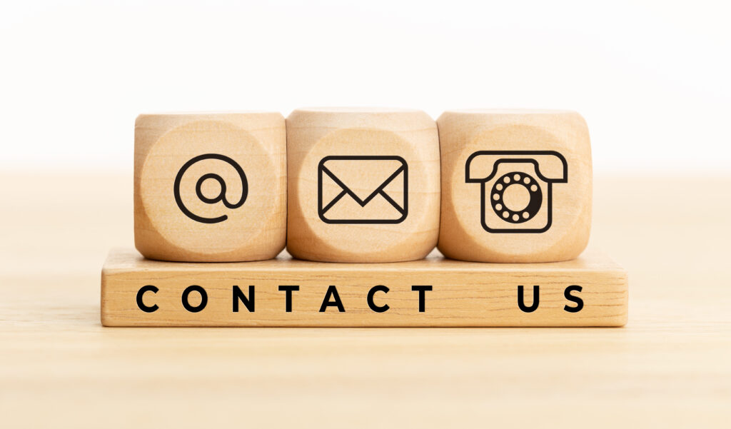 Contact us concept. Wooden blocks with email, mail and telephone Contact us for 24/7 taxi Service